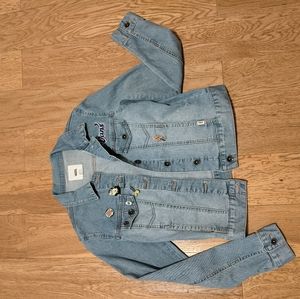 Denim jacket with vintage pins